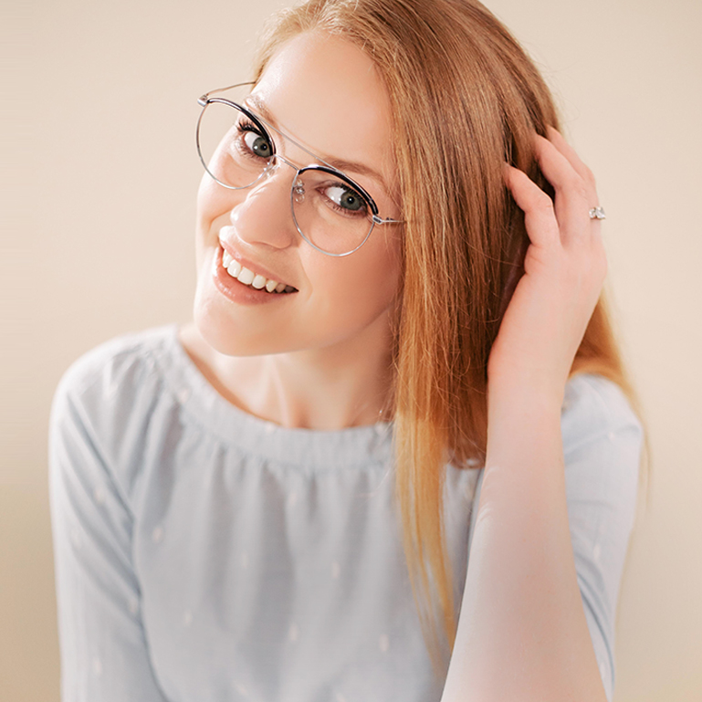 a woman wearing titanium glasses
